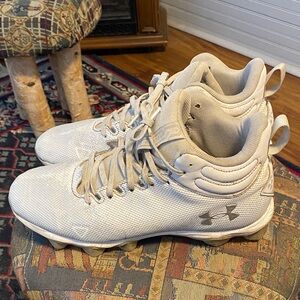 Under Armour Light Gray and white High-Top football Cleats.